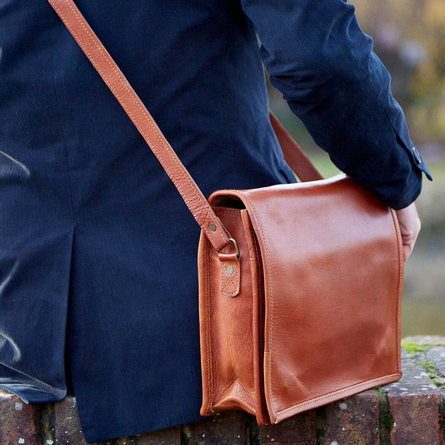 brown leather crossbody backpack Coffee Canvas which opens into an interior with a zip pocket Men's Small Pebble Grain Leather